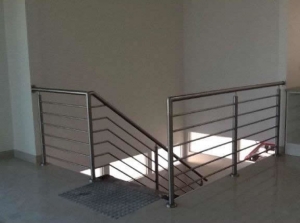 Stainless steel handrail with round tube infill's fabricated and installed onto concrete floor/ metal beam to suit.